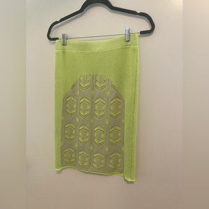 Dagmar casual skirt— like green with beige lace overlay on front.